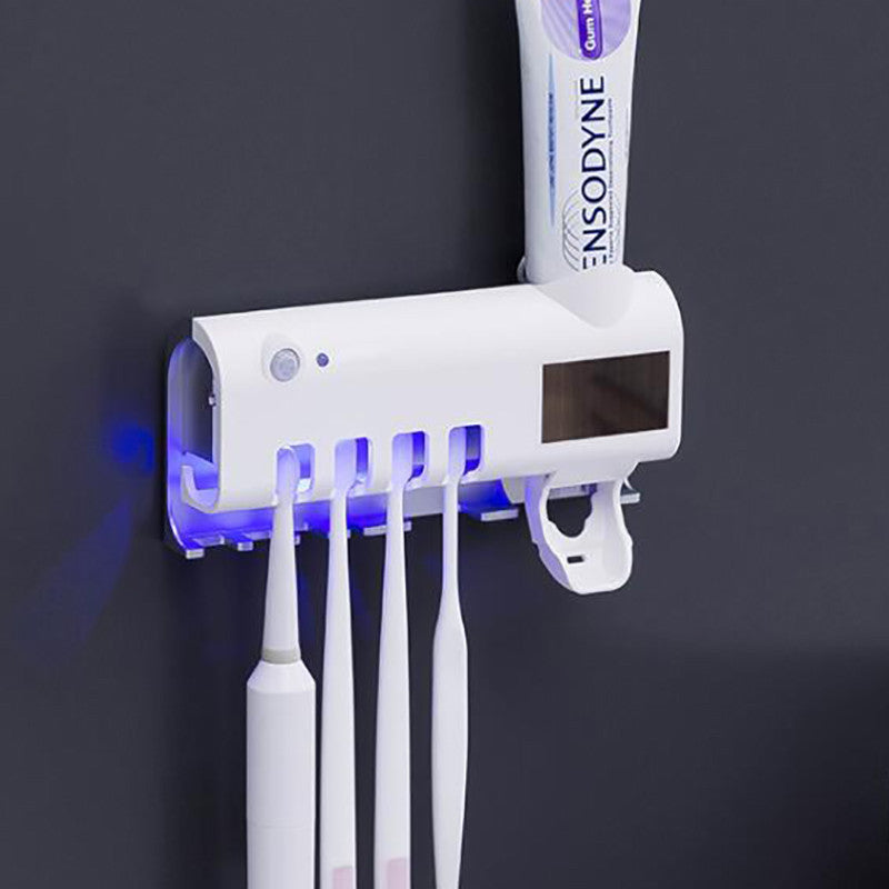 Inovatyvus dantų higienos įrenginys su UV sterilizatoriumi ir dantų pastos dozatoriumi