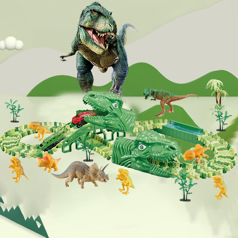Žalios dinozaurų formos žaislų trasa su įvairiaspalviais dinozaurais ir augalais.