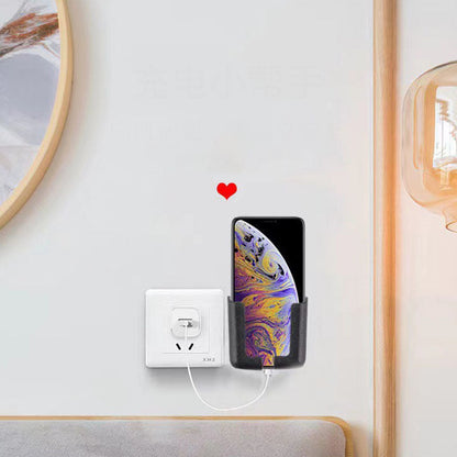 Telefonas vertikaliai pritvirtintas prie sienos šalia lizdo
