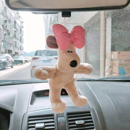 Šuniuko formos automobilio dekoracija parodytas rankoje su funkcine detale