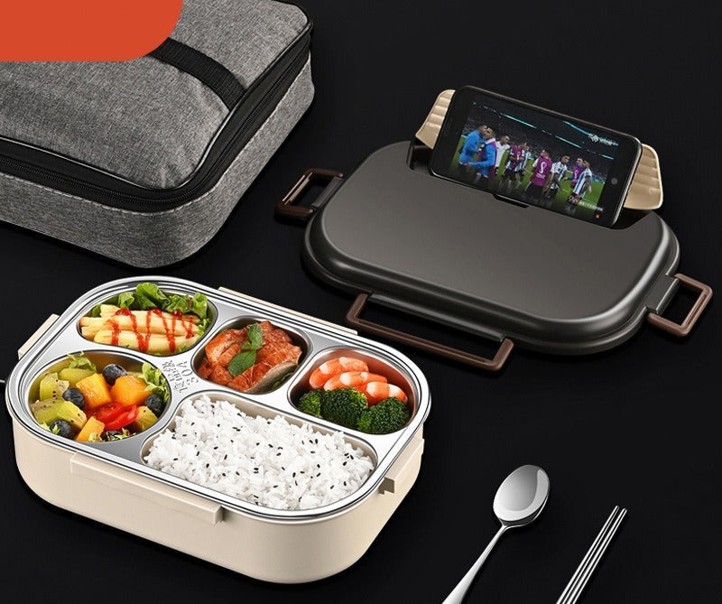 Daugiafunkcinis pietų dėklas su šviesiai pilku, metaliniu paviršiumi ir mobiliojo telefono laikikliu.