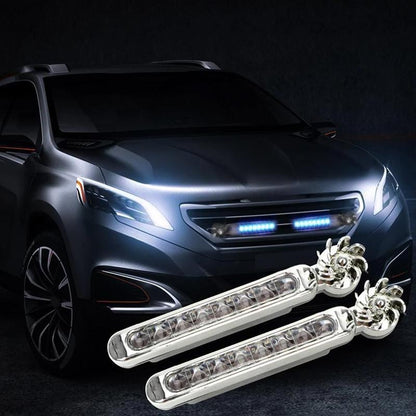 Mėlyni LED žibintai sumontuoti juodo automobilio priekyje