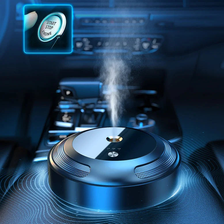 Apskritas mėlynas prietaisas su mygtuku, skleidžiantis garus, automobilio salone.
