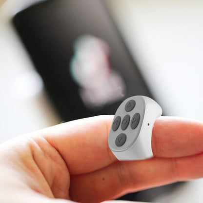 Bluetooth žiedinis telefono pultelis – baltas ant piršto