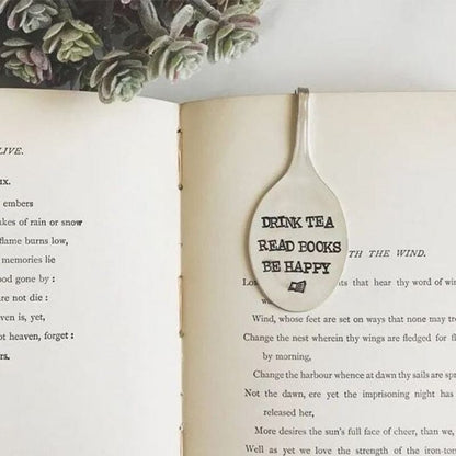 Drink tea read books be happy skirtukas atverstoje knygoje