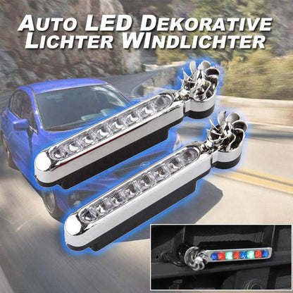 Du sidabro spalvos LED žibintai prie mėlyno automobilio