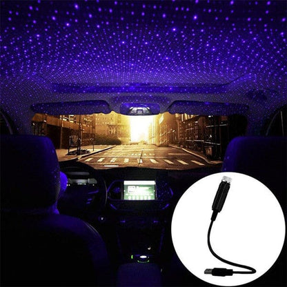 USB projektorius automobilyje su violetinių taškelių šviesos efektu.